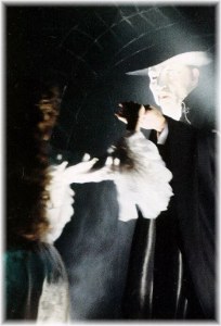 Phantom leads Christine through the mirror.